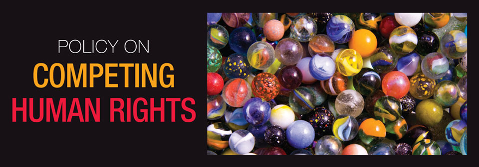 'Policy on competing human rights' text with a bunch of marbles